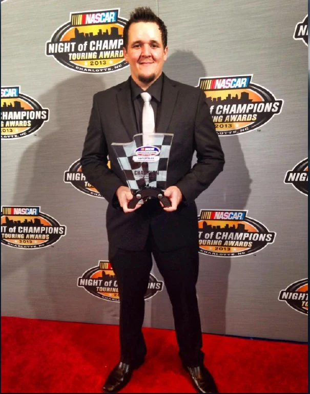 Tyler Hudson with his 2013 championship trophy